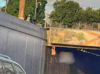 Hombre colgado en el túnel de Las Américas